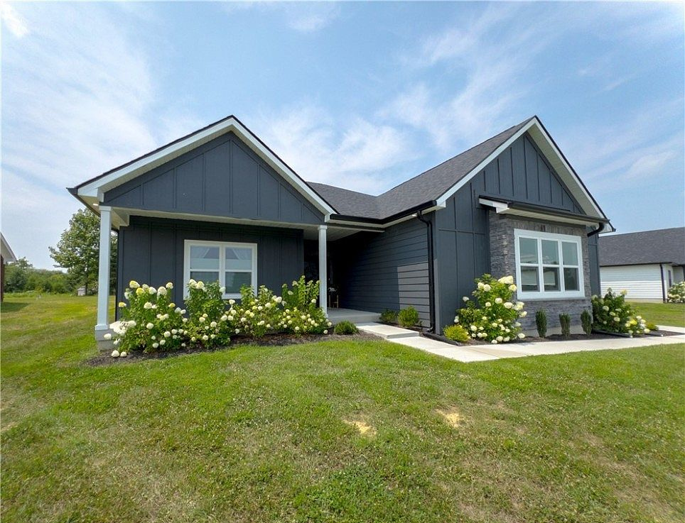 Blue-gray home with twin gables at 686 Sun Studio Drive